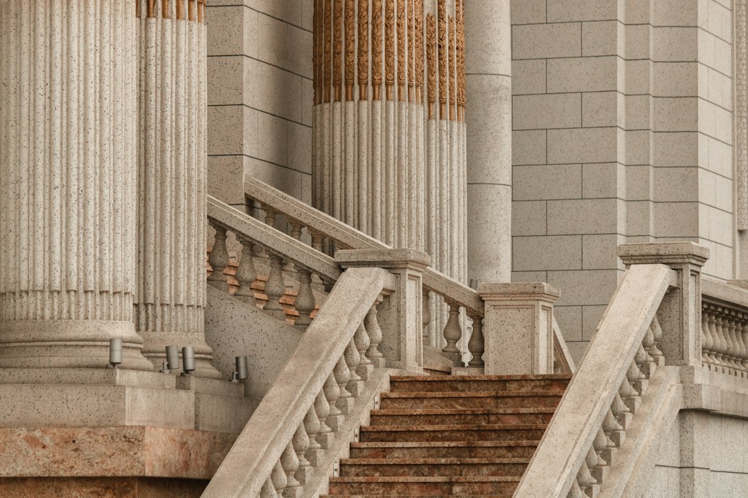 Stone steps and columns at a civic building, with no people present.