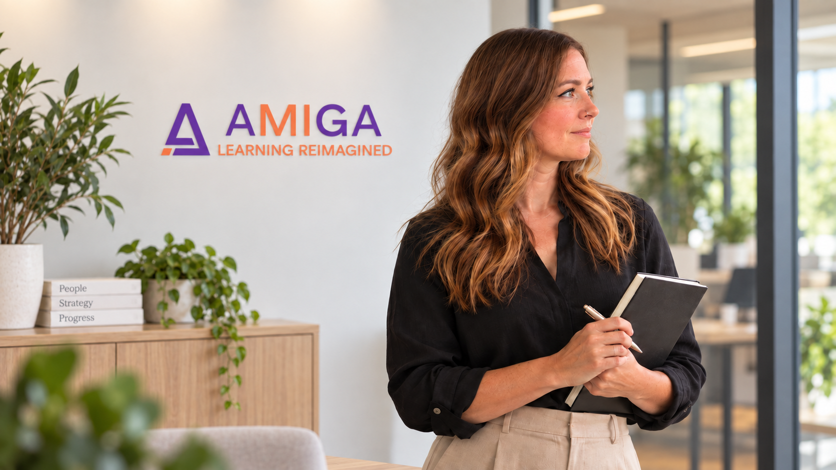 AMIGA team member holding a notebook.